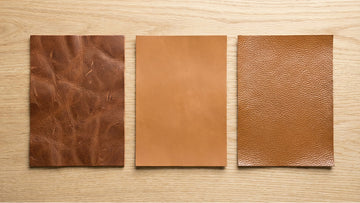 Three leather swatches side by side showing the surface texture differences between full-grain, top-grain, and genuine leather