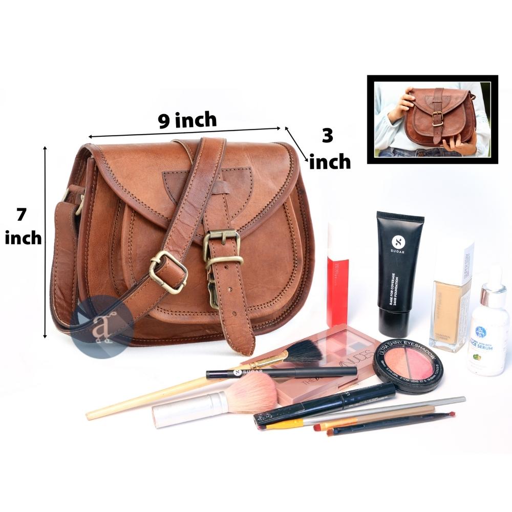  Brown Leather Saddle Purse Measuring 9 x 7 x 3 Inches, Displayed with Assorted Makeup Items and an Inset Image Showing Size Reference