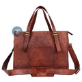 Front View of Brown Leather Laptop Tote Bag with Adjustable Shoulder Strap, Brass Buckles, and Front Pocket