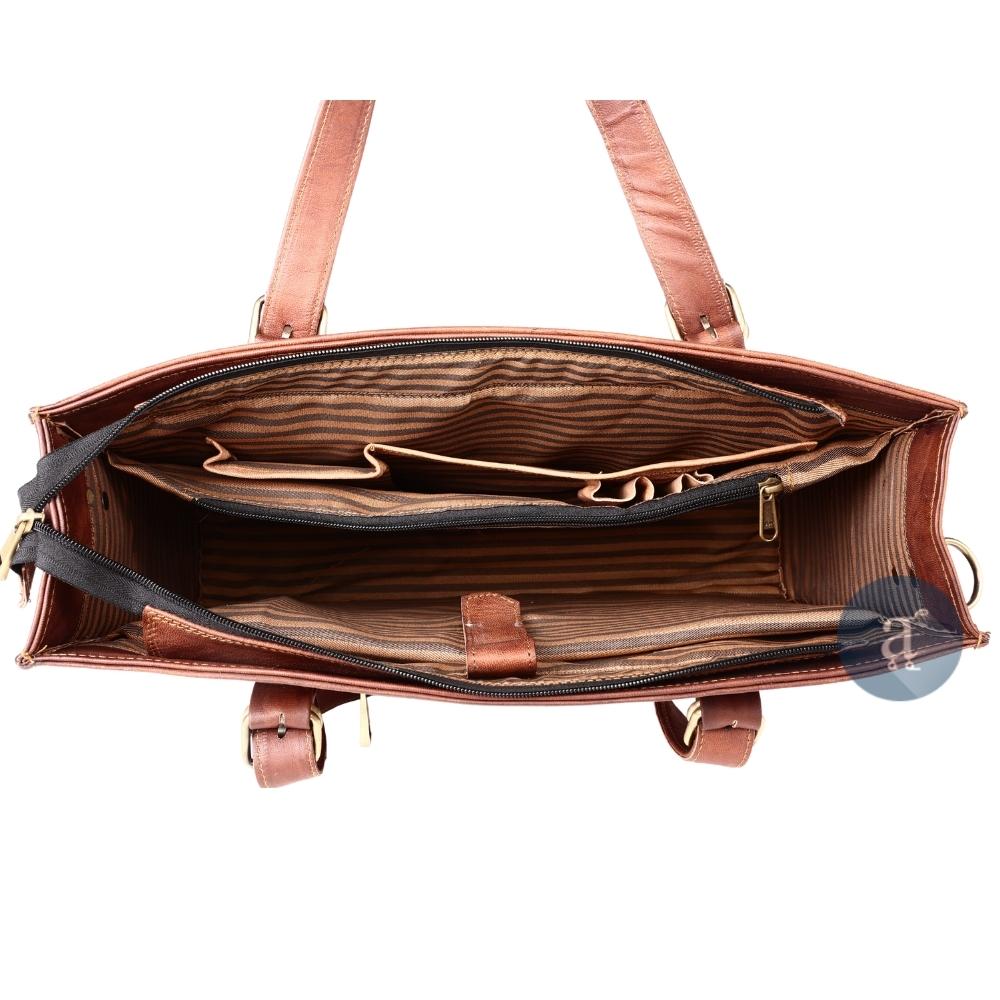 Interior View of Laptop Tote Bag for Women Showing Multiple Compartments, Striped Lining, and Zipper Pockets