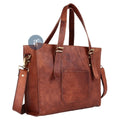 Side View of Brown Leather Laptop Tote Bag Showing Brass Buckle Details, Adjustable Strap, and Sleek Design