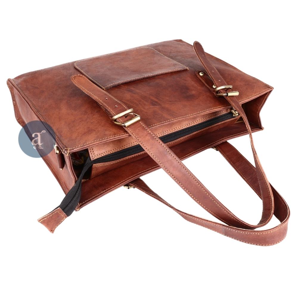 Angled View of the Leather Laptop Tote Bag for Women with Open Zipper, Showing Spacious Interior and Brass Buckles