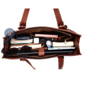 Top View of a Leather Laptop Tote Bag Packed with Essentials, Showing Organized Compartments and Zipper Pockets