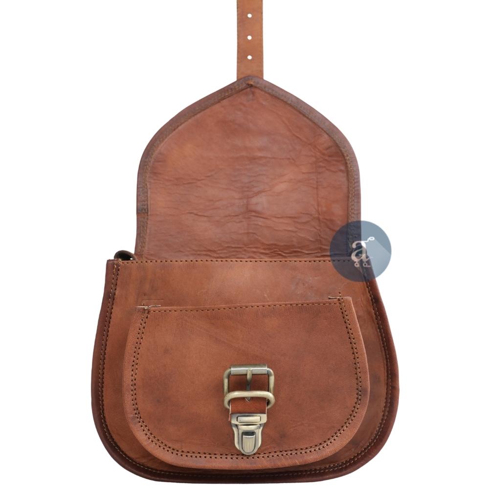 Interior View of Open Brown Leather Saddle Purse with Push Lock Buckle