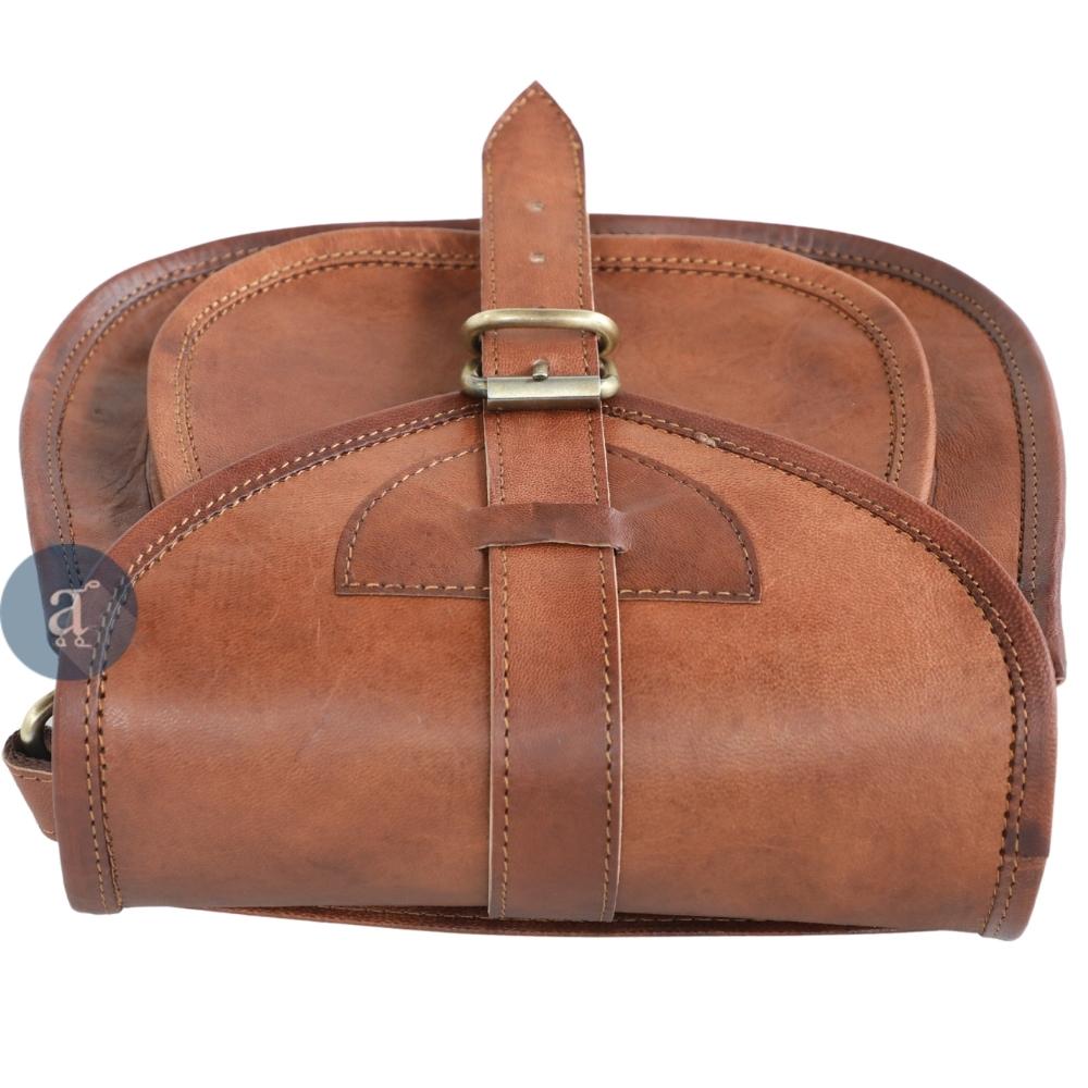 Top View of Closed Brown Leather Saddle Purse with Buckle, Highlighting Detailed Stitching On the Flap