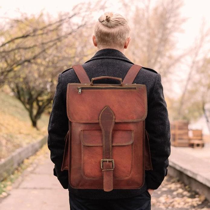 Men Carrying Brown Leather Backpack with Backstraps 