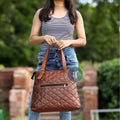 Women Carrying Designer Brown Designer Tote with Handles