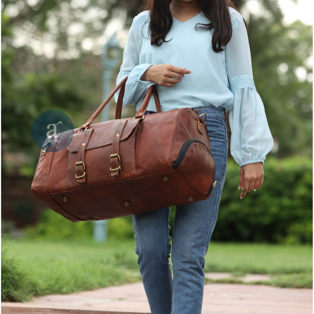 Women Carrying Leather Weekender Bag With Shoe Compartment from Top Handles
