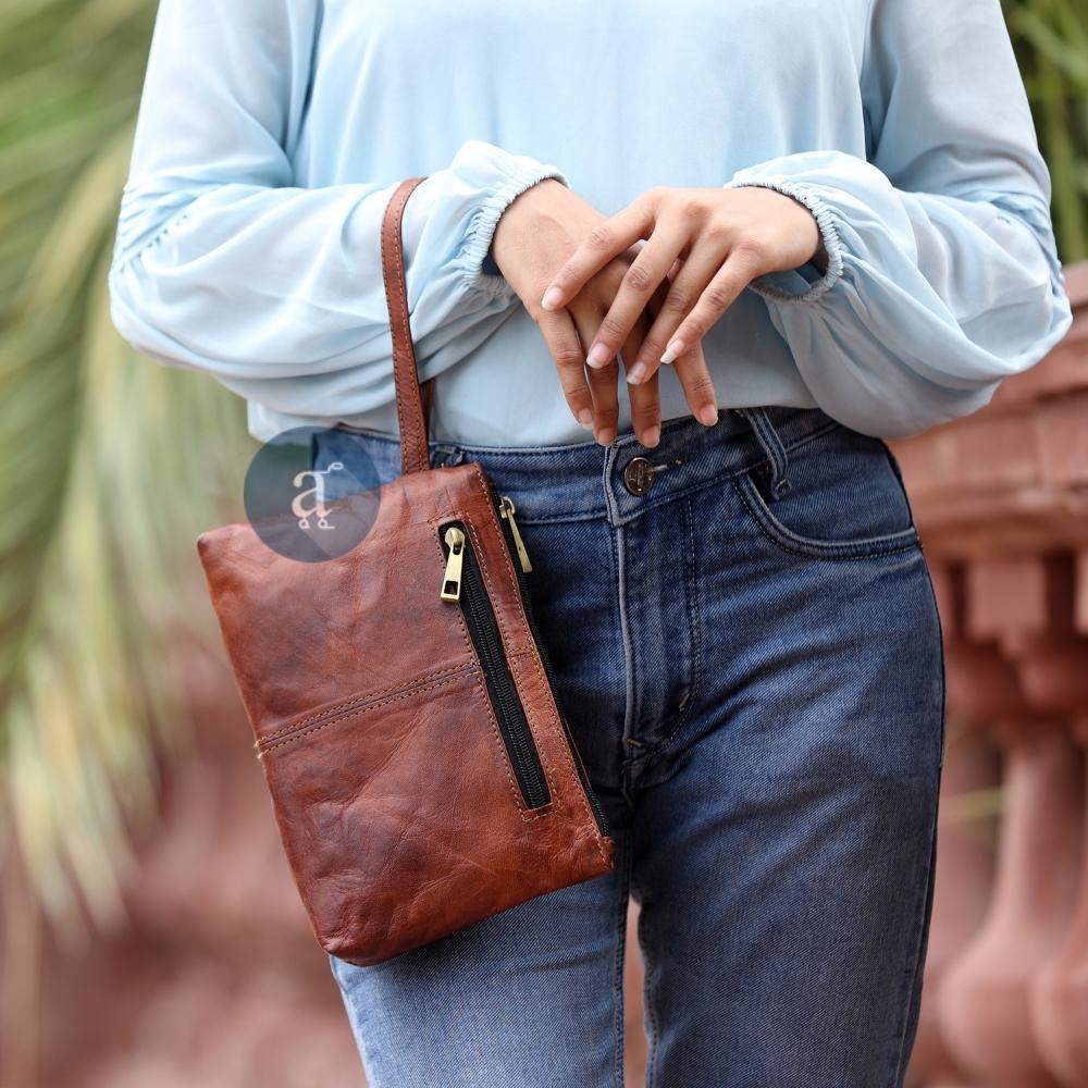 Women Carrying Small Brown Leather Purse