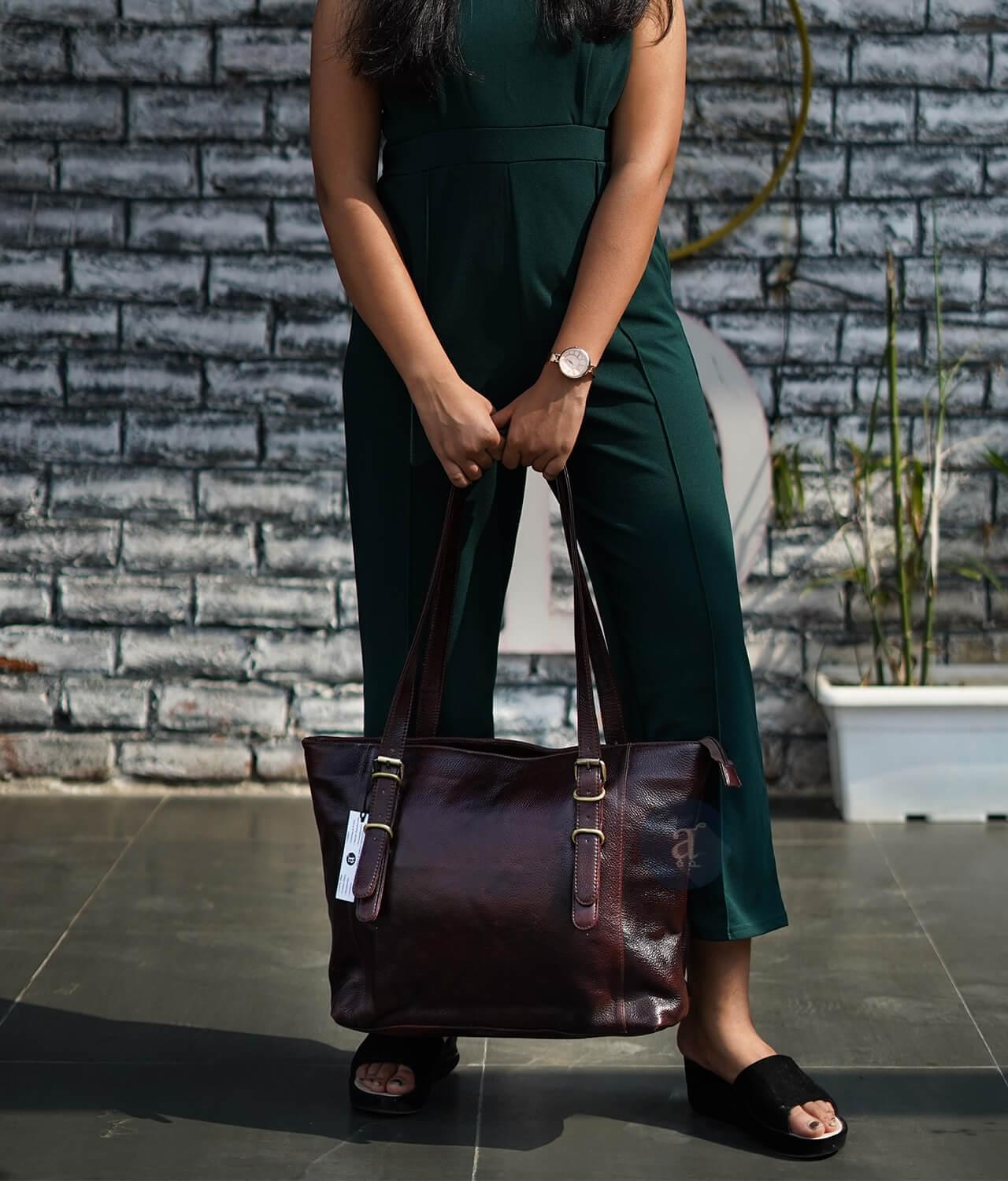 Women Carrying Brown Purse with Handles